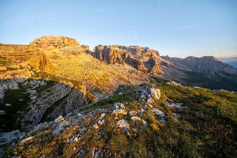 View of rocky mountain peaks of the Brenta Mountains at sunset, Alpenglühen, mountain landscape on the Grosté Plateau, Brenta, Parco Naturale Brenta-Adamello, Trentino, Italy