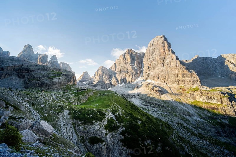 Picturesque mountain landscape in the morning, Rifugio Ai Brentei mountain hut and Cima Tosa rock peak, Brenta, Trentino, Italy