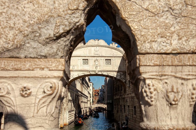 View of the Bridge of Sighs through the railing of the Ponte della Paglia, Venice, Veneto, Italy