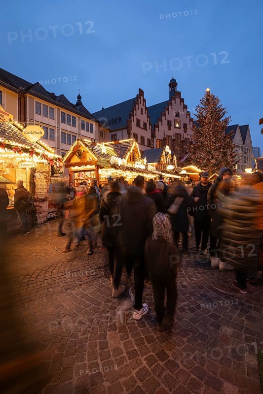December 22, 2025, Frankfurt Christmas Market on Roemerberg at twilight. Traditional wooden stalls and festive lights shine in the historic square, Frankfurt, Hesse, Germany