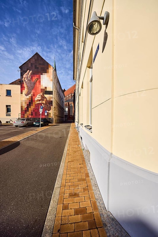 Residential buildings, apartment buildings, modern façade painting, brick sidewalk, asphalt road, parking lot with cars, blue sky, altocumulus clouds, Domstraße, Schwerin, state capital, district-free city, Mecklenburg-Western Pomerania, Germany