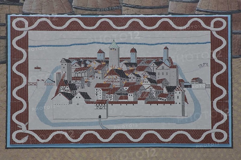 Historical wall by artist group Kollektiv K 2020, wall mosaic with historic city fire, cityscape with city wall and city fortification, painting on city history, house façade, street art, eels, Swabian Jura, Baden-Württemberg, Germany