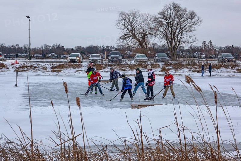 Detroit, Michigan USA - 1 January 2026 - As temperatures dropped and snow fell in the Great Lakes region, people shoveled ice off Lake Okonoka in Belle Isle State Park to play ice hockey on New Year's Day