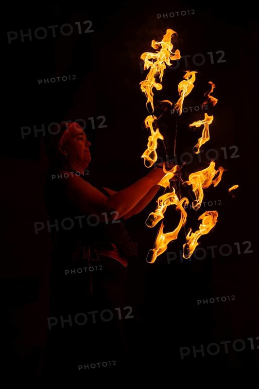 Fakelkranz is moved by woman, Feuer, Raunacht, Winter, Waldburg Castle, Allgäu, Baden-Württemberg, Germany
