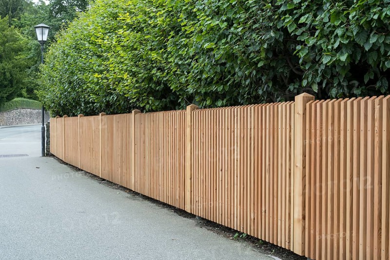 Wooden fence on the side of the road, vertical slats, town of Tegernsee, Upper Bavaria, Bavaria, Germany