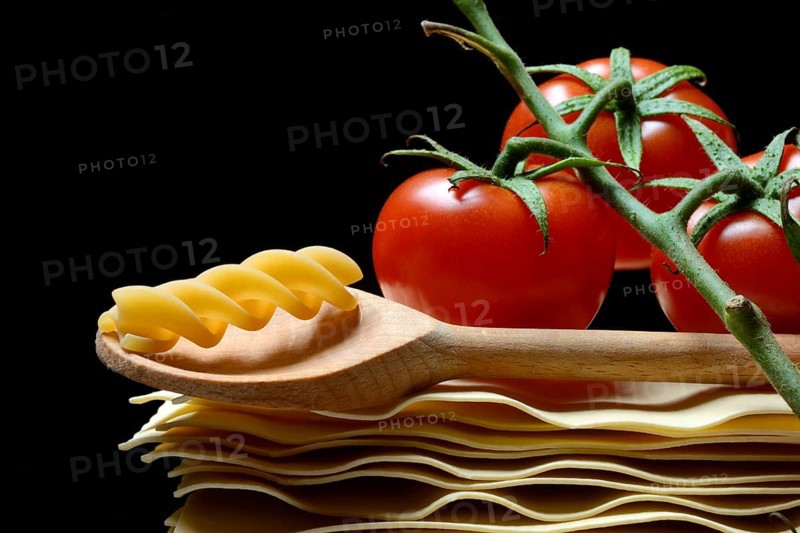 Lasagna, lasagna leaves and cooking spoon with fusilli noodle, noodle nest pasta type