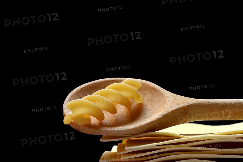 Lasagna, lasagna sheets and cooking spoon with fusilli noodle, spiral noodle, type of pasta