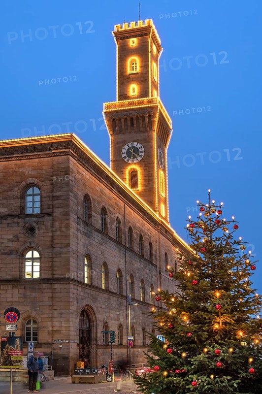Fürth Town Hall in evening lighting, the tower is imitated the tower of the Palazzo Vecchio in Florence, on the right a decorated Christmas tree, blue evening sky, Fürth, Middle Franconia, Bavaria, Germany