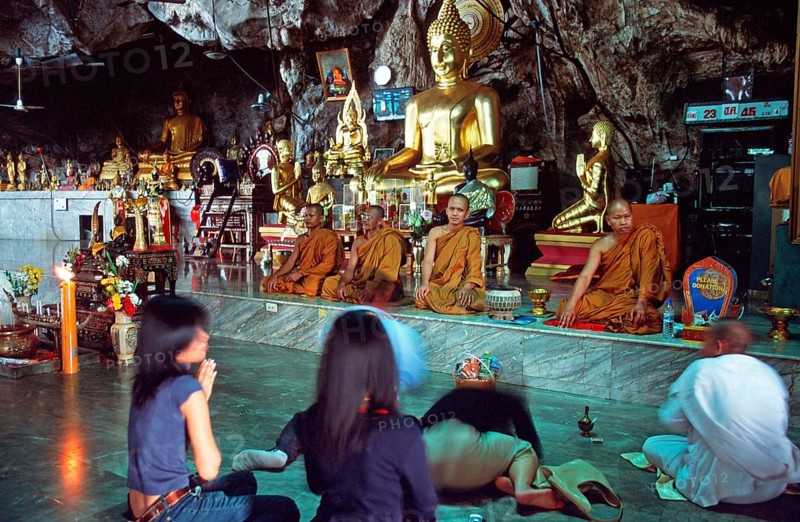 Buddha statue, monks and believers praying, Wat Tam Sua monastery near Krabi, Thailand, December 2002, vintage, retro, old, historic