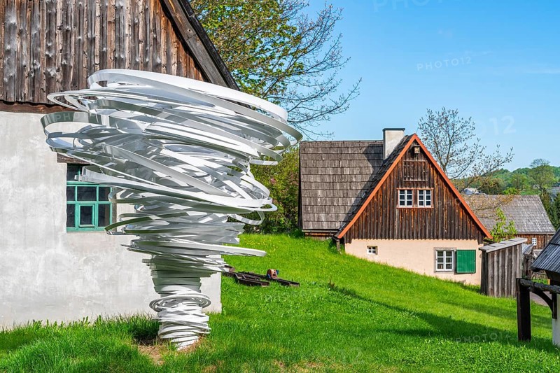 Sculpture, art installation Twister by artist and sculptor Alice Aycock, Purple Path art and sculpture trail of the European Cultural Region around the cultural capital Chemnitz, next to historic wooden houses in the Seiffen open-air museum, Ore Mountains, Saxony, Germany