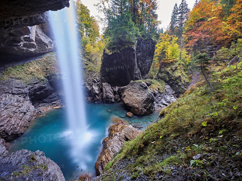 Waterfall mountain list in autumn-colored surroundings, Linthal, Klausenpass, Canton of Glarus, Switzerland