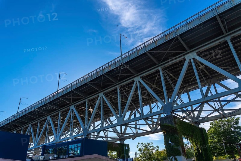 Granville street bridge standing tall against vibrant blue sky, showcasing its impressive steel structure and offering scenic view of vancouver cityscape