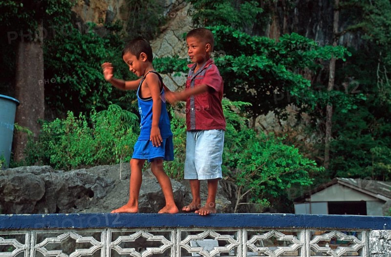 Little boys, children in the stilt village of Ko Pannyi in Phangnga Bay near Ko Phuket, two years in front of the tsunami, Thailand, December 2002, vintage, retro, old, historic
