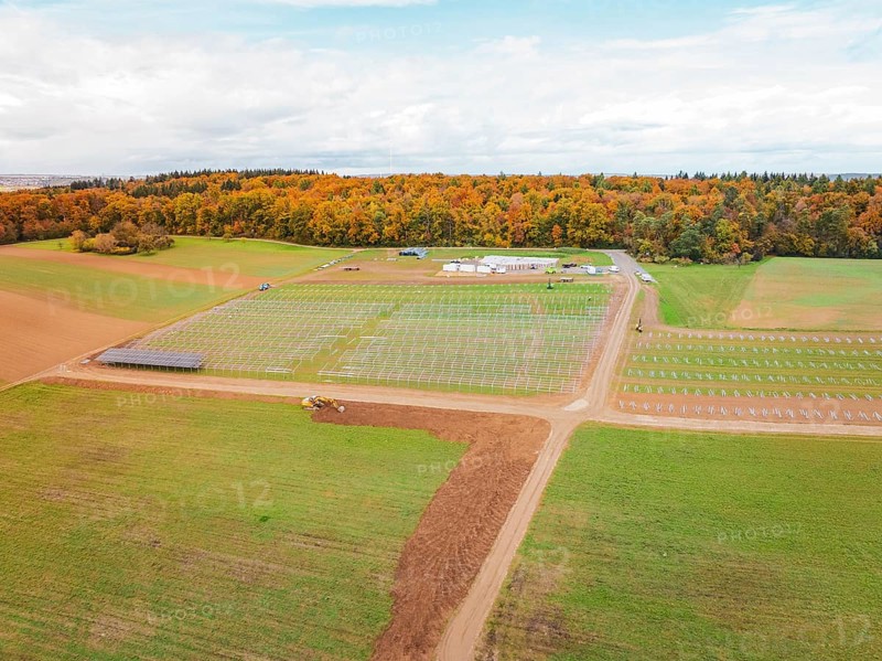 Wide landscape with fields and construction areas for solar systems near forest, energy transition, construction of PV open space, Baden-Württemberg, Germany