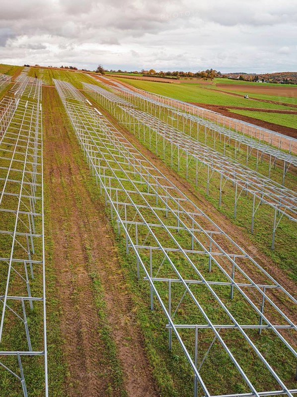 Structures of a solar plant during the construction phase on green fields, energy transition, construction of PV open space, Baden-Württemberg, Germany