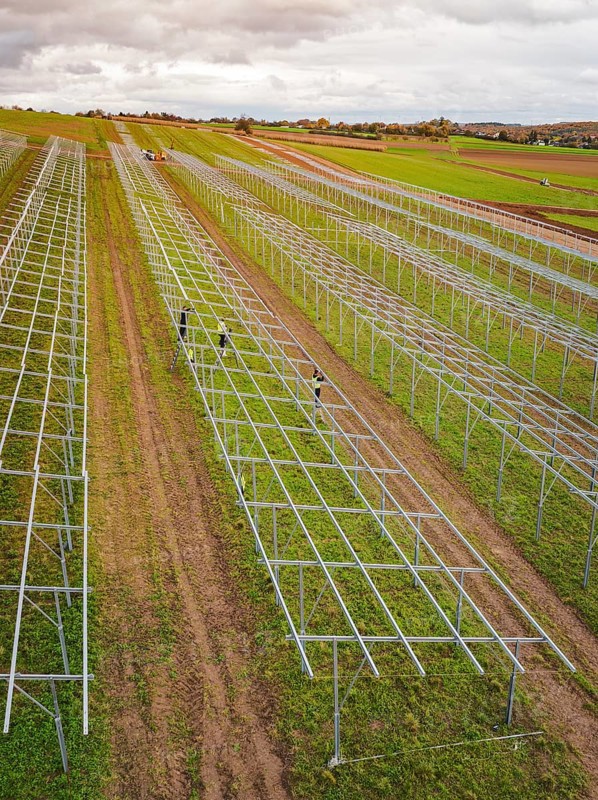Structures of an incipient solar plant in fields in a rural area, energy transition, construction of PV open space, Baden-Württemberg, Germany