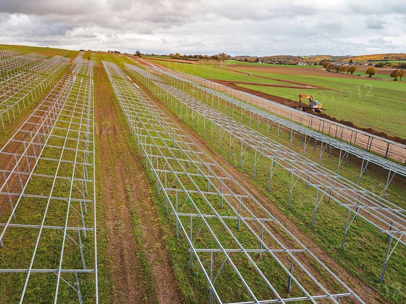 Solar system under construction in fields in a rural landscape, energy transition, construction of PV open space, Baden-Württemberg, Germany