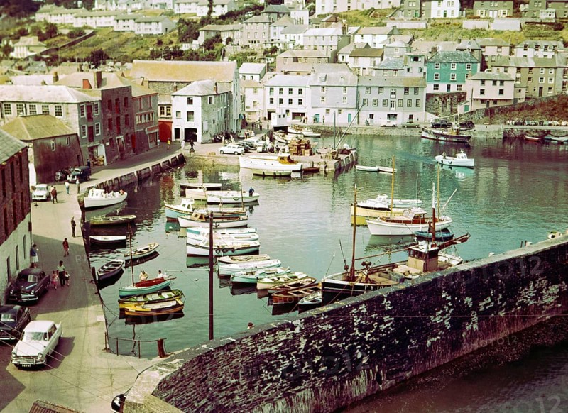 Boats at moorings in the harbour at seaside fishing village of Mevagissey, Cornwall, England, UK c 1960