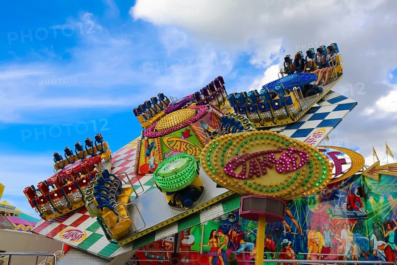 Fairground in Ulm Friedrichsau, folk festival, hustle and bustle, amusement park, amusement attraction, ride, blue sky, clouds, Ulm, Baden-Württemberg, Germany