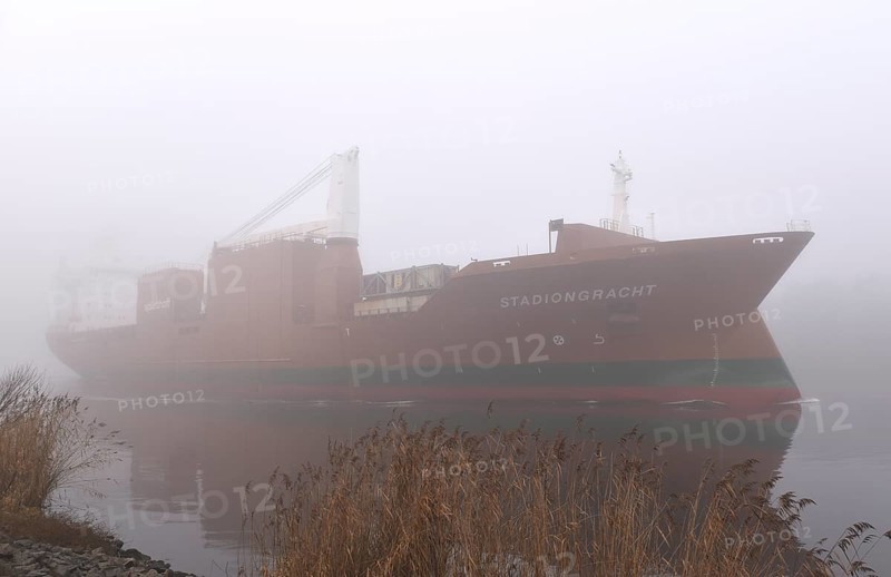 Freighter STADIONGRACHT in fog in the Kiel Canal, NOK, Kielkanal, Kielcanal, Schleswig-Holstein, Germany