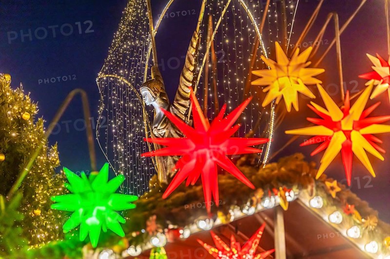 Baroque Christmas market with illuminated angels between the Protestant City Church and the Catholic Church of the Most Holy Trinity. Sights on the market square in the evening. Ludwigsburg, Baden-Württemberg, Germany