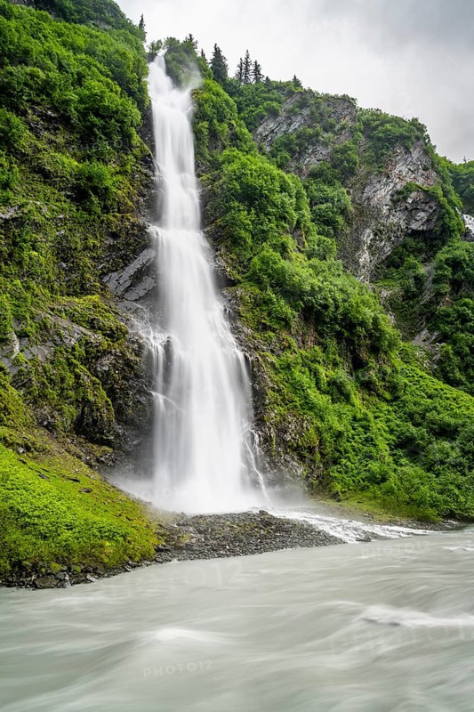 Horsetail Falls waterfall on the Lowe River in a green gorge, long exposure, Keystone Canyon, Richardson Highway, Alaska, USA