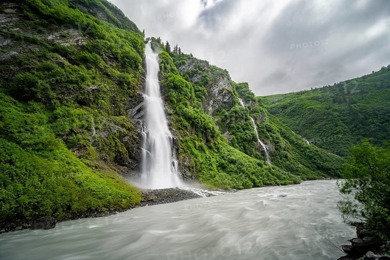 Horsetail Falls waterfall on the Lowe River in a green gorge, long exposure, Keystone Canyon, Richardson Highway, Alaska, USA