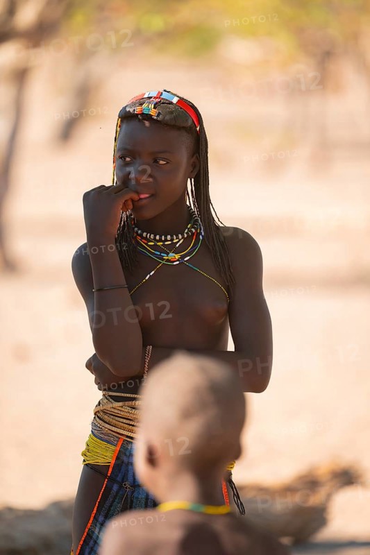 Portrait, brightly decorated girl of the Hakaona tribe, also Havakona or Hakawona, near Opuwo, Kunene, Namibia