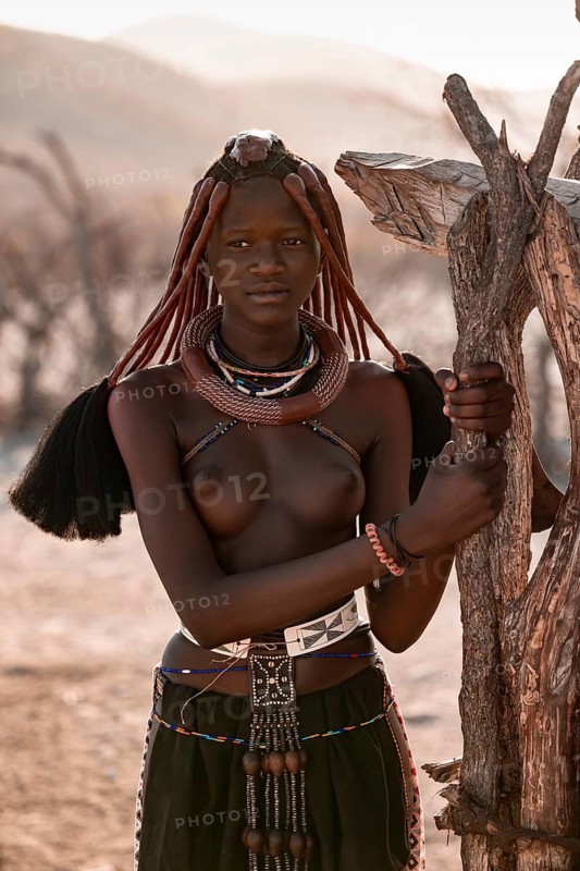 Young Himba woman with jewelry, portrait, traditional Himba village, Kaokoveld, Kunene, Namibia