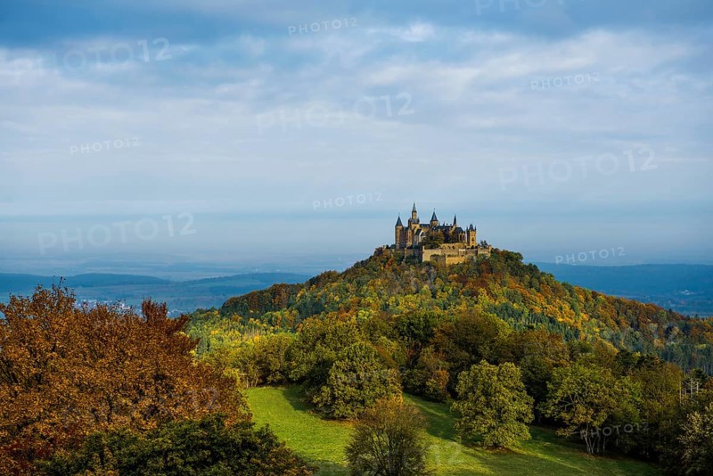 Castle and autumnal forest, Hohenzollern Castle, sunrise, Hechingen, Swabian Jura, Baden-Württemberg, Germany