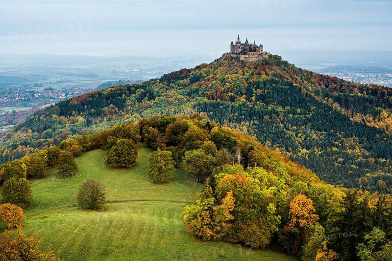 Castle and autumnal forest, Hohenzollern Castle, Hechingen, Swabian Jura, Baden-Württemberg, Germany