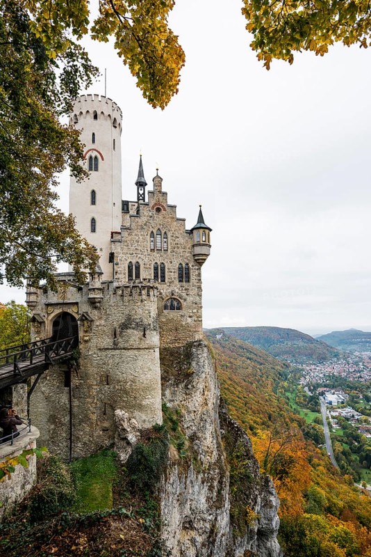 Castle and autumnal forest, Lichtenstein Castle, Honau, Echaz Valley, Swabian Jura, Baden-Württemberg, Germany