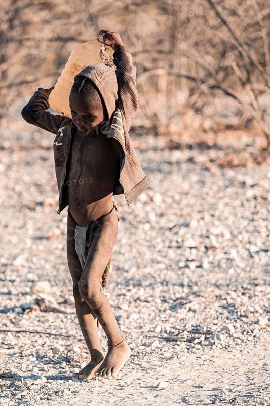 Himba child fetches water, carries canisters, traditional Himba, Kaokoveld, Kunene, Namibia