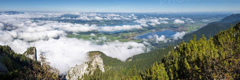 Panorama from Tegelberg, 1881m, of the cloud-covered Forggensee and Bannwaldsee, Ostallgäu, Bavaria, Germany