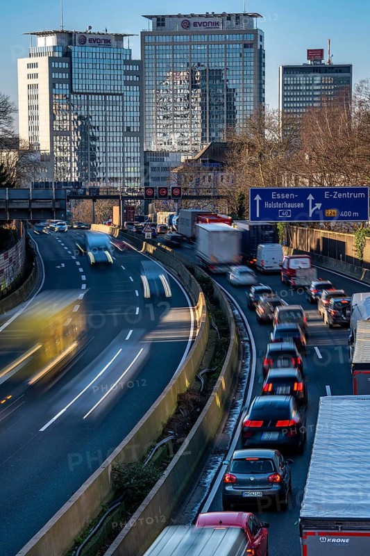 The A40 motorway, Ruhrschnellweg, in Essen, city skyline, Evonik office building, traffic jam in the westbound lane, Duisburg, slow traffic, North Rhine-Westphalia, Germany