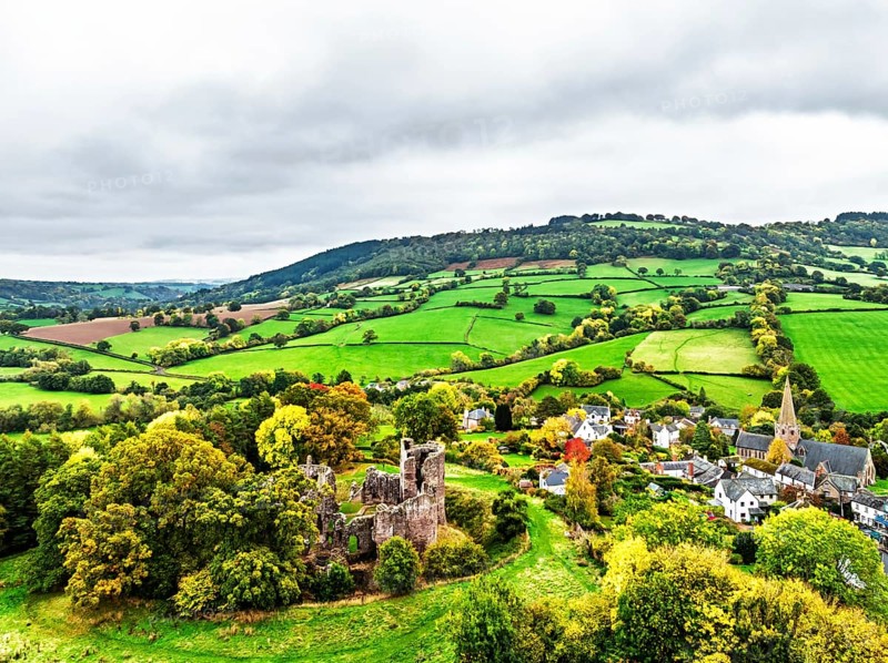 Autumn Colours over ruins of Grosmont Castle from a drone, Grosmont, Monmouthshire, Wales, UK