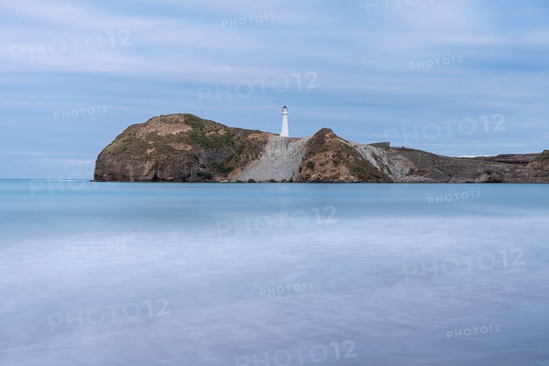 Castlepoint Beach with lighthouse on the rock, ocean, long exposure. Castlepoint, Wairarapa Coast, Wellington Region, North Island, New Zealand