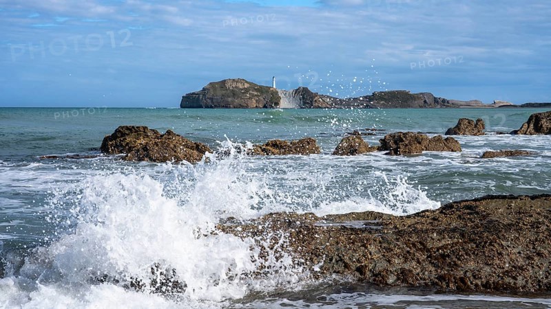 Castlepoint Beach and Castlepoint Lighthouse, ocean, waves, surf, sandy beach, rocks. Castlepoint, Wairarapa Coast, Wellington Region, North Island, New Zealand