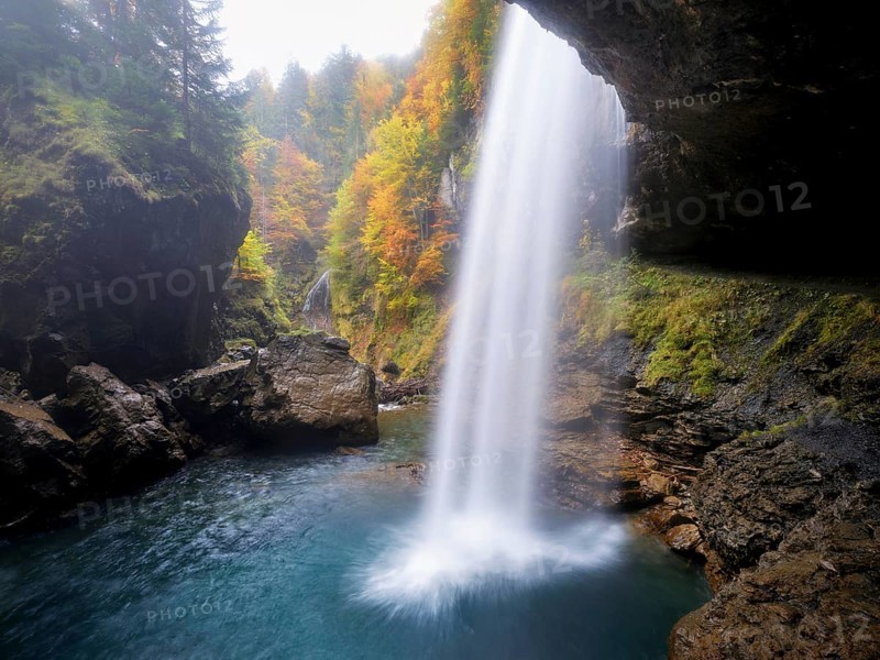 Waterfall mountain list in autumn-colored surroundings, Linthal, Klausenpass, Canton of Glarus, Switzerland