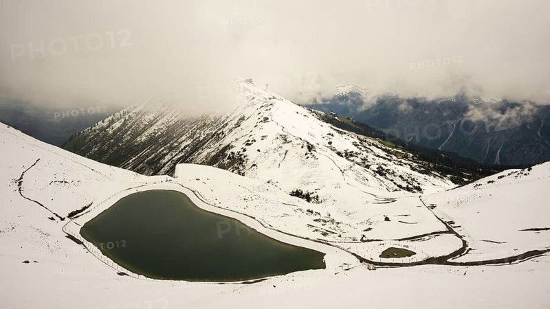 Another onset of winter in May, Riezler Alpsee, an artificially created lake, snow pond, feeds the snow cannons that completely snow the slopes of the Fellhorn and Kanzelwand cable cars, Allgäu Alps, Vorarlberg, Austria