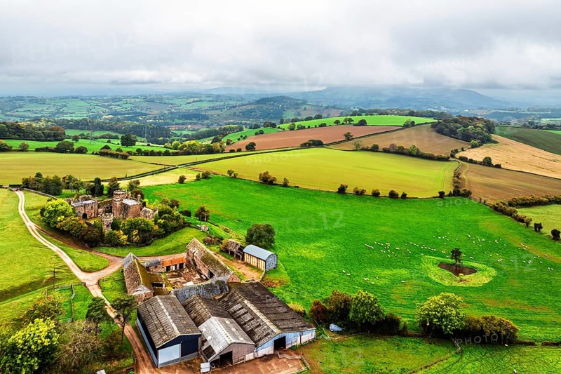 Autumn Colours over ruins of Pembridge Castle or Newland Castle from a drone, Herefordshire, England, United Kingdom