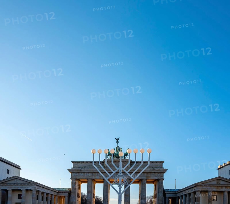 Large Hanukkah chandelier at the Brandenburg Gate in daylight, sign of lively Jewish life, symbolic power for 20 years, Berlin, Germany