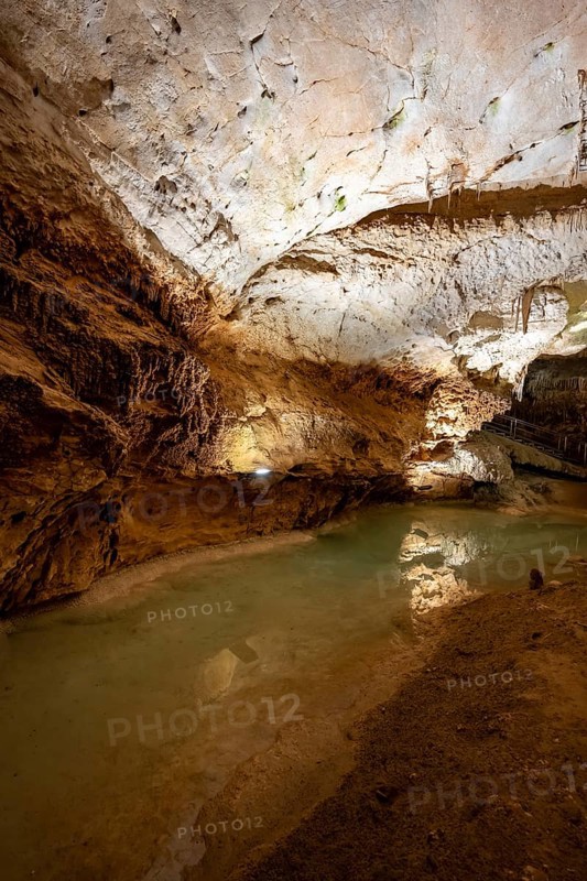 Stalactites and stalagmites, reflection in a small underground lake, rock formations in a stalactite cave, Grotta del Fico, Gulf of Orosei, Baunei, Sardinia, Italy