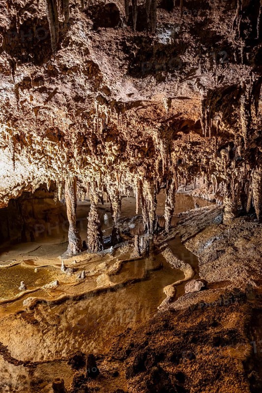 Stalactites and stalagmites, water basins and rock formations in a stalactite cave, Grotta del Fico, Gulf of Orosei, Baunei, Sardinia, Italy