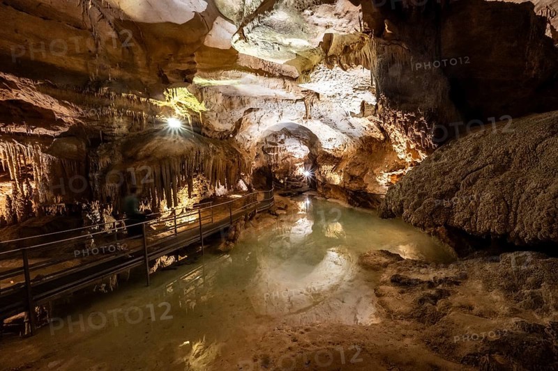 Stalactites and stalagmites, small underground lake, rock formations in a stalactite cave, Grotta del Fico, Gulf of Orosei, Baunei, Sardinia, Italy