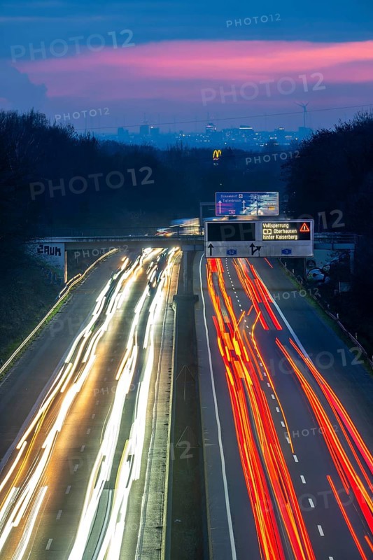 Evening traffic on the A52 motorway, between Düsseldorf and Essen, in front of the Breitscheid motorway junction, partly slow rush hour traffic, looking south, North Rhine-Westphalia, Germany