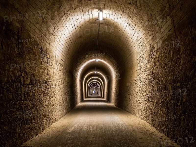 Tunnel del Castillo, Coripe Mountain Tunnel, illuminated longest tunnel on cycle path Via Verde de la Sierra, Puerto Serrano to Olvera, old railroad track, Andalusia, Spain