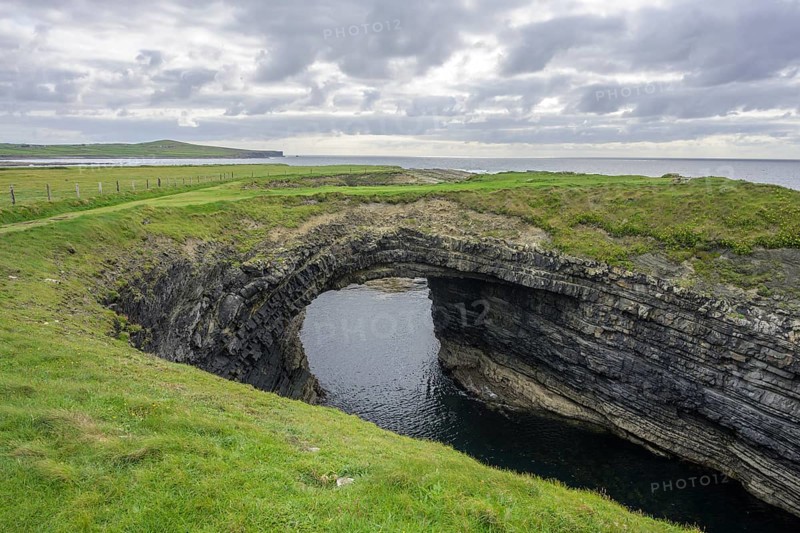 Bridges of Ross rock arch, Kilballyowen, County Clare, Ireland