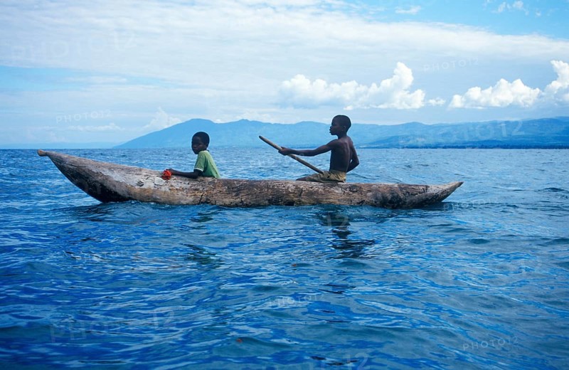 Two boys in a dugout on Lake Malawi, Malawi, Africa, July 2000, vintage, retro, old, historic
