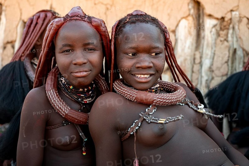 Group of Himba people, Himba woman, traditional Himba village, Kaokoveld, Kunene, Namibia
